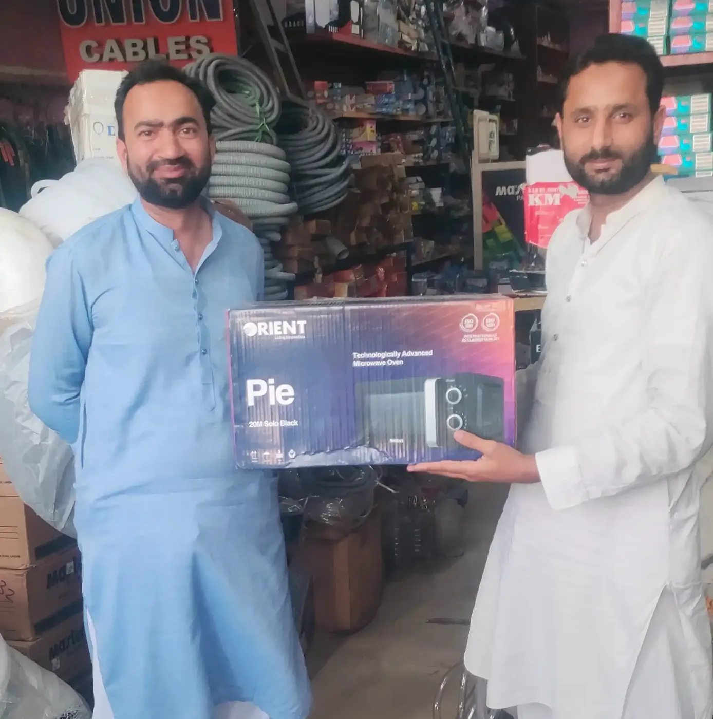 An Orient microwave oven handed over as a customer prize at the counter
